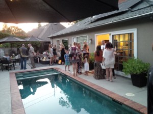 Guests mingle poolside in Sherman Oaks